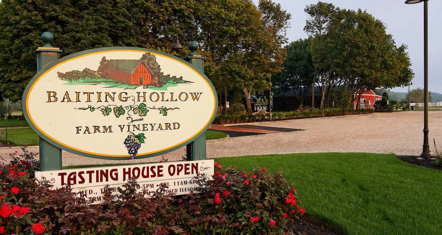 Entrance sign and landscaped grounds at Baiting Hollow Farm Vineyard